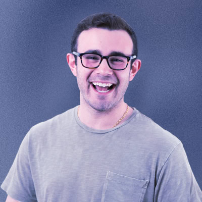 A man wearing glasses and a green shirt.